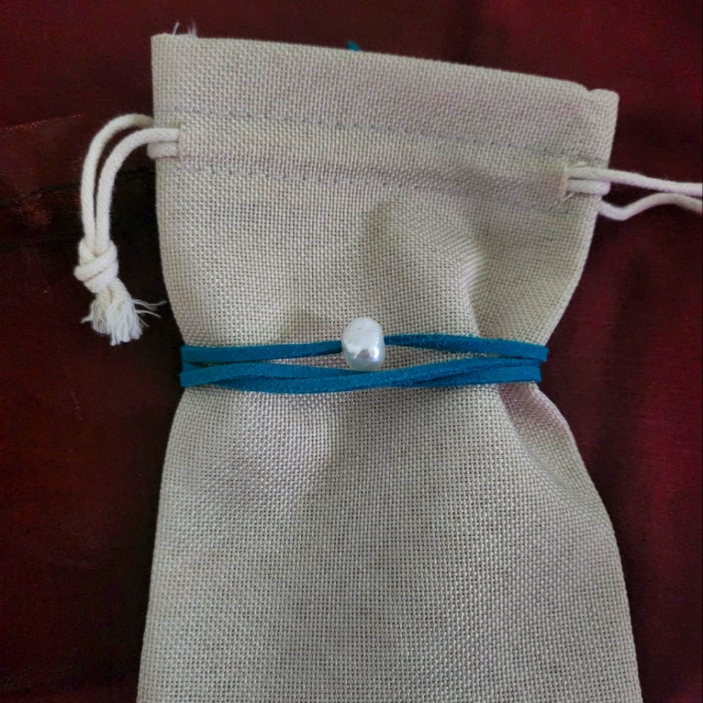 Fresh water pearl with leather cord